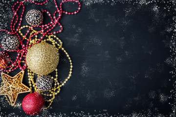 Fototapeta na wymiar Christmas decorations on black matte background