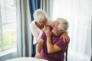 Senior couple hugging each other