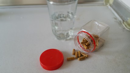 Chinese herb medicine and a glass of water.