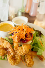 Fried Shrimp Salad with dressing and fruit dressing