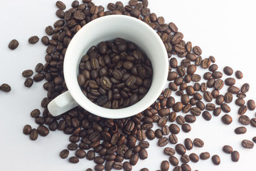 Close up coffee beans and and paper on with table