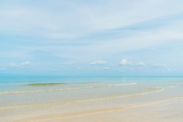 Fototapeta na wymiar Beautiful exotic beach and gentle wave with blue sky