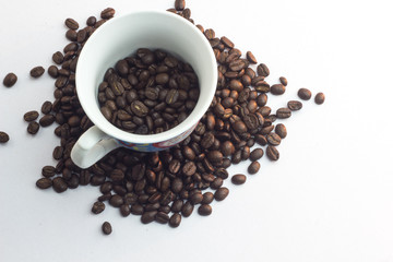 Close up coffee beans and and paper on with table