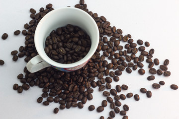 Close up coffee beans and and paper on with table