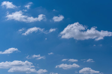 White fluffy  clouds with blue sky