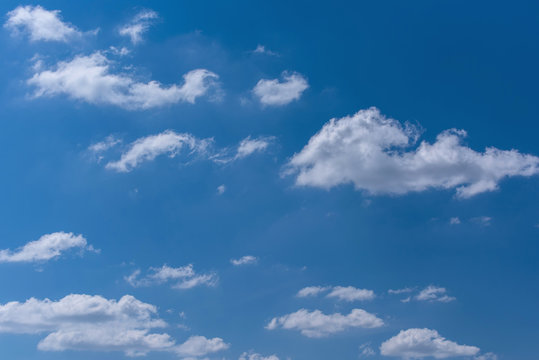 White fluffy  clouds with blue sky