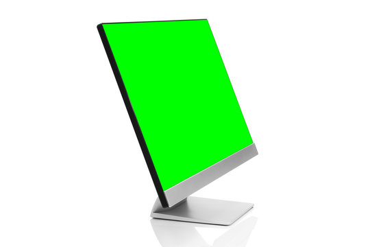 Sleek modern computer display with blank green chroma key screen, front side view tilted and isolated on white background with reflection