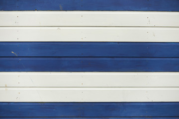 A full page of blue and white wooden beach hut background texture