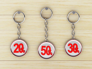 Fototapeta na wymiar Set of silver keychains with red 20,30,50 percentages discount on wooden background. 3D illustration 