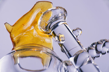 Close up view of a piece of cannabis oil concentrate aka shatter