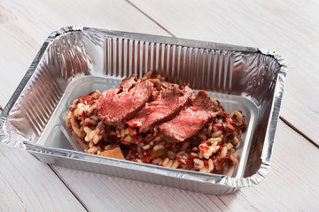 Healthy food in box, diet concept. Beef Pastrami