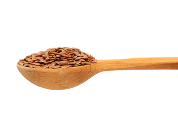 Brown flax seeds isolated on white background