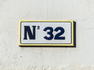 Street sign reading the number thirty-two.