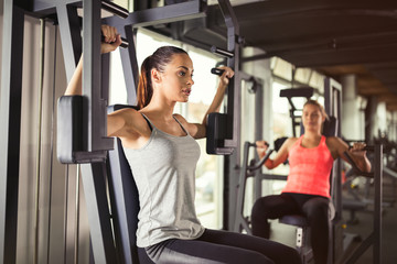 Fototapeta na wymiar Women working out in gym