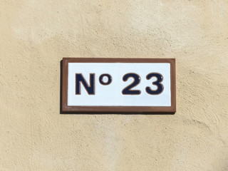 Street sign reading the number twenty-three.