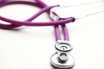 Closeup of a medical stethoscope, isolated on white background