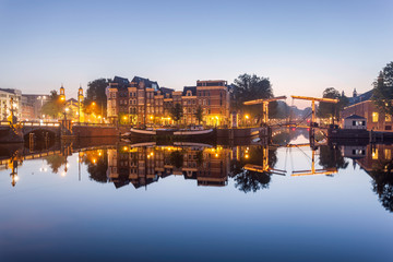 Fototapeta na wymiar Amstel canal cantilever lifting bridges-Holland