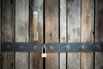 locked wooden door background with dark vignette, 