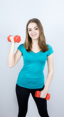 Naklejka premium girl with dumpbells on white background sport concept gym