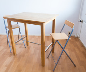 Table and chairs in an empty room