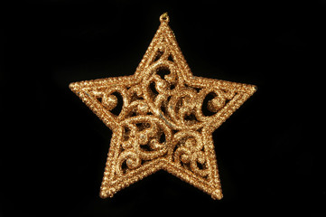 Gold glitter Christmas star on black