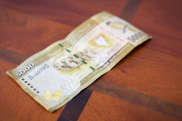 Пять тысяч рупий.