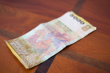 Пять тысяч рупий.