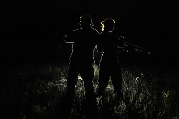military silhouettes of a man and a woman