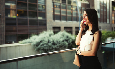 Beautiful businesswoman using phone