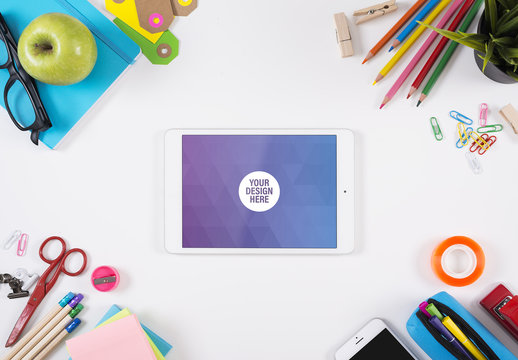 Tablet on White Desk  Surrounded by Art Supplies Mockup 1