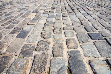 The cobblestone road.
