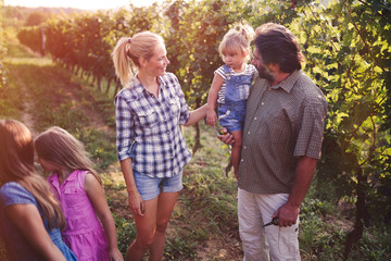 Wine grower family in vineyard