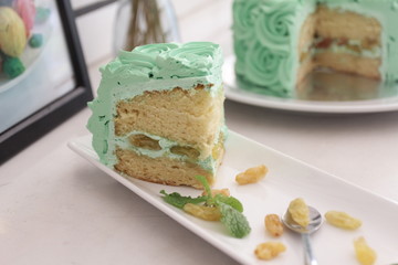 Piece Buttercream birthday cake over white background