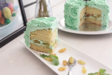 Piece Buttercream birthday cake over white background