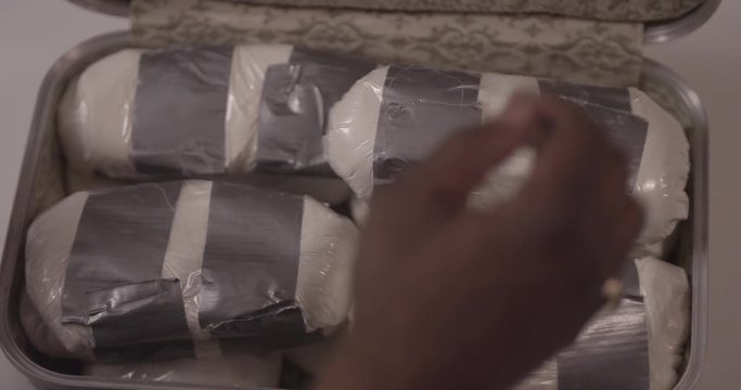 Cocaine_Bricks_Kilos_Suitcase_Hands.mov
