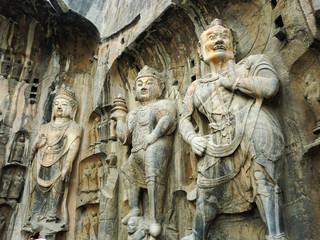 Obraz premium Ancient Buddha carvings into rock in southern China site