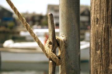 Rustic sailor's knot on cleat in Rockport Harbor, Massachusetts
