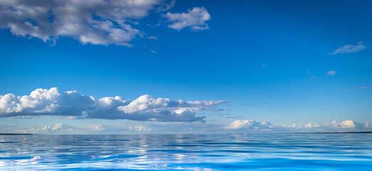 Naklejka na ściany i meble View of horizon line with summer sky and blue ocean