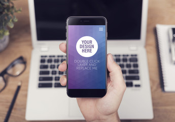 Closeup of a Smartphone in User's Hand Mockup 2 - Powered by Adobe