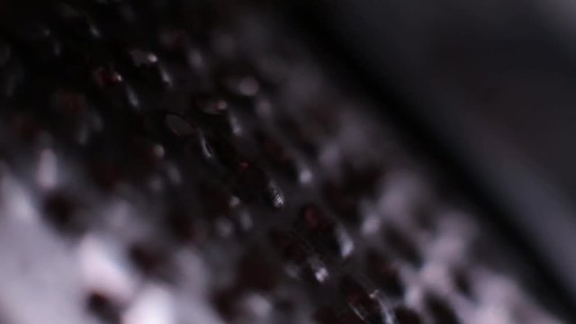 cutting of chocolate grater closeup.
