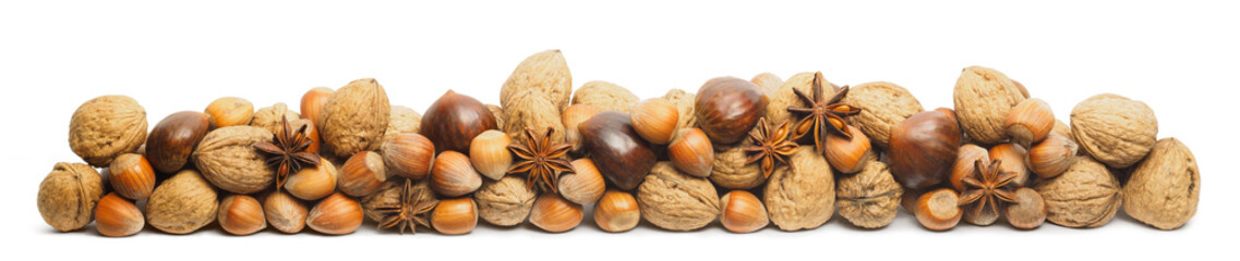 Stacked nuts for decoration isolated on white backdrop