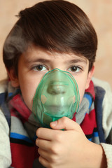 preteen boy with electric inhaler