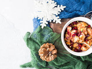 Christmas baked apple dessert with pomegranate. Top view