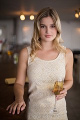 Portrait of beautiful woman holding a champagne flute