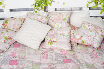 pillow and blanket on the bed in rustic