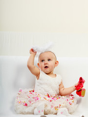 Fototapeta premium Little girl with red shoes