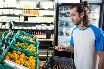 Man holding basket while shopping