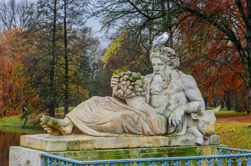 a beautiful sculpture in the autumn Lazienki Krolewskie Park, Warsaw, Poland