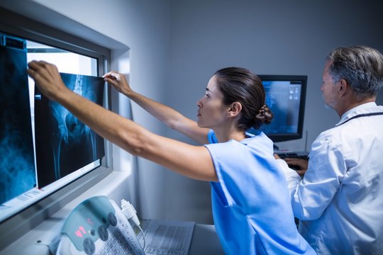Nurse examining a x-ray