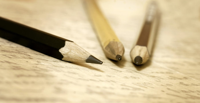 Website banner of pencils and handwriting letter